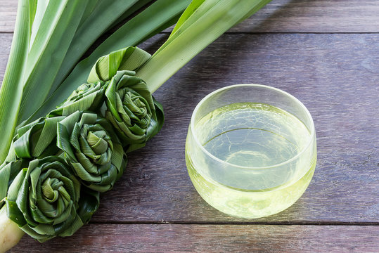 Pandan Juice In Glass And Flowers Crafts From Pandan Leaves , On The Wood Table