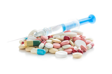 Syringe and pills.