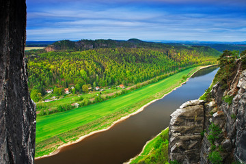 Elbe river, view from Bastei bridge in Saxon Switzerland, at sunrise and the mist over the river Elbe, National park Saxon Switzerland. Beautiful Germany landscape. Summer morning with river landscape