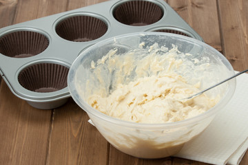 Raw Muffin Dough. Cooking Process. Baking Tray With Paper Cases.