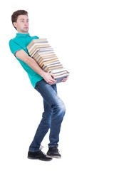 front view of going  handsome man carries a stack of books. walking young guy . Rear view people collection.  backside view of person.  Isolated over white background. Thin student carries a heavy