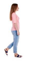 back view of walking  woman . beautiful redhead girl in motion.  backside view of person.  Rear view people collection. Isolated over white background.