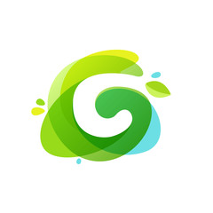 Fototapeta premium Letter C logo at green watercolor splash background.