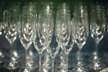 Many beautiful original glasses are on the table