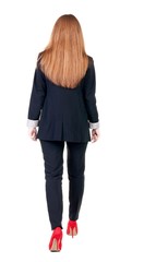 walking red head business woman. back view. going young girl in  suit. Rear view people collection.  back side view of person.  Isolated over white background.