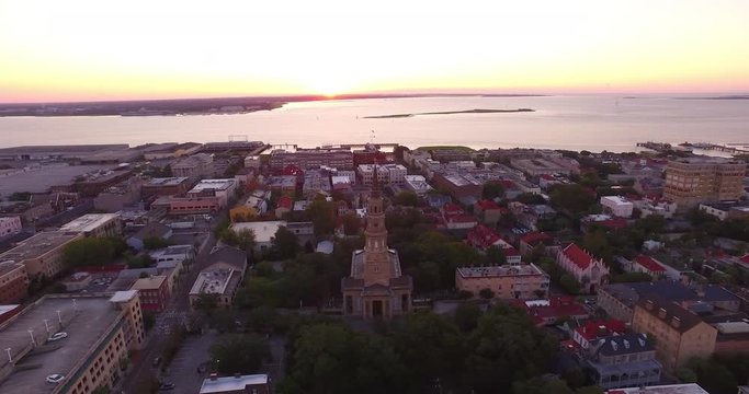Aerial perspective of the St. Philip&rsquo;s Episcopal Church and French Huguenot Church in downtown Charleston, SC, as well as the Arthur Ravenel Jr. Bridge.
