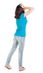 Back view of shocked woman in blue jeans. girl hid his eyes behind his hands.  Rear view people collection.  backside view of person.  Isolated over white background.