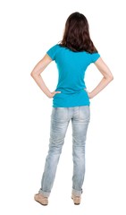 back view of standing young beautiful  brunette woman in jeans. girl  watching. Rear view people collection.  backside view of person.  Isolated over white background.