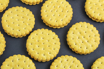 Vanilla sweet cream cookies on black background