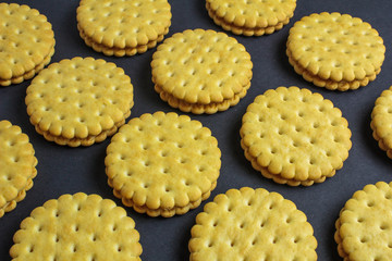 Vanilla sweet cream cookies on black background