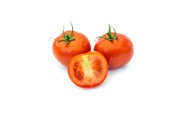 Fresh tomatoes and a slice isolated on a white background.