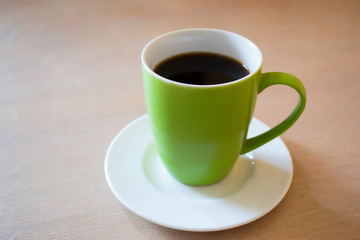 Green cup of coffee