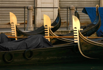 five gondolas in Venice at dusk