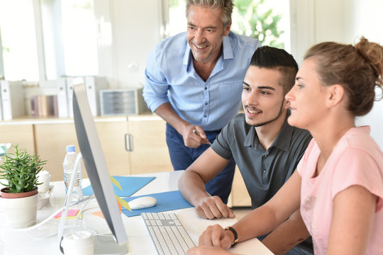 Students in business class with trainer