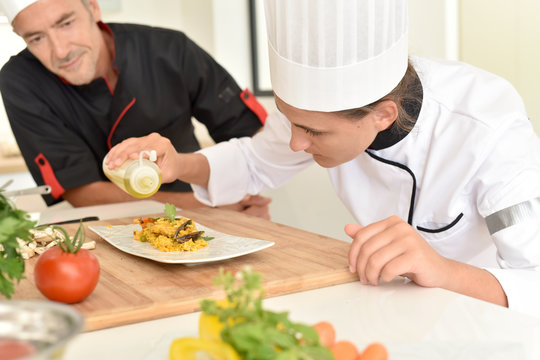 Young cook student in training course