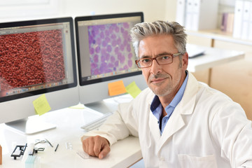 Portrait of microbiology scientist in office