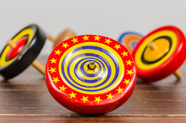 Old colorful wooden spinning top toy