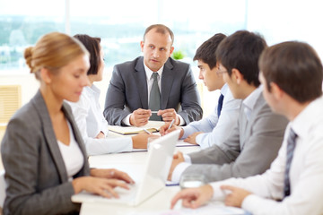 Successful group of business people having a meeting