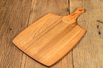 wooden chopping board on wooden table