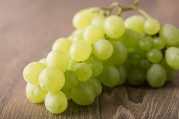 Fresh grapes on wooden background