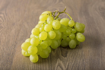 Fresh grapes on wooden background
