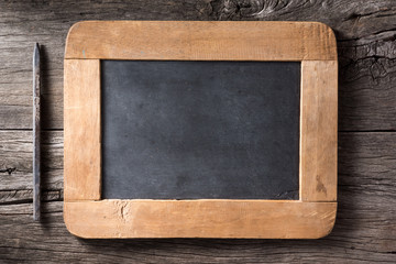 slate and pencil on old wood