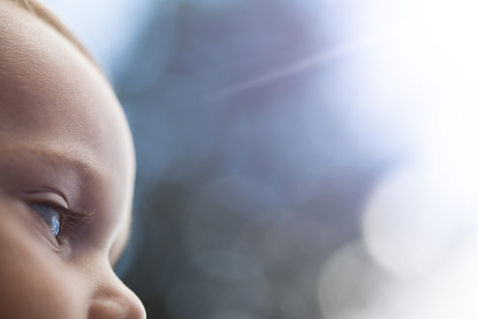 Child Looking Up At The Sky