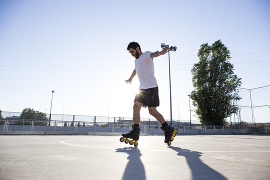Man with rollerblades skating
