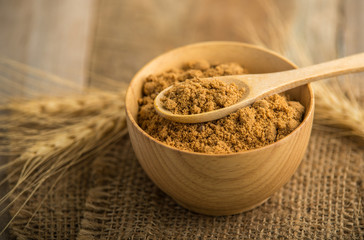 coconut palm sugar against an out of focus