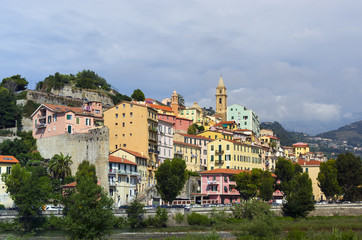 Fototapeta na wymiar A view on an italian town of Ventimiglia with its colorful buildings