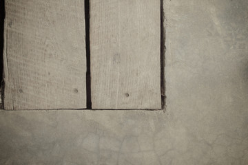 Cement floor and wooden background