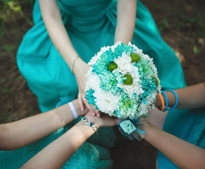 Amazing wedding bouquet in the hands of bridesmaids