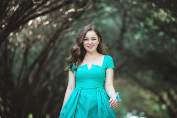 Charming bridesmaid in the beautiful park