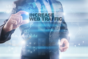 Businessman is selecting "Increase web traffic" on the virtual screen.