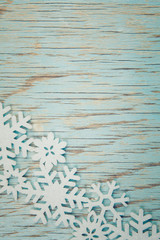Fototapeta premium A christmas decoration on a turquoise vintage background