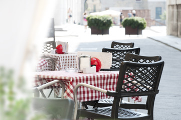 tables of street cafe in the Italian city