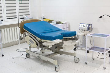 Medical bed in labour room at modern hospital