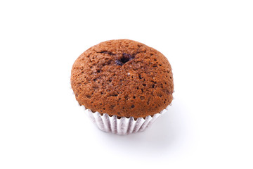 Close up of chocolate cup cake on a white background.