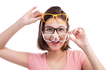 Closeup portrait of a young cheerful asian woman in glasses