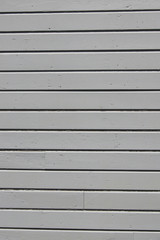 Gray wall siding with horizontal lines