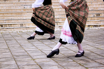 the appearance of the dancers is seen only from their feet which