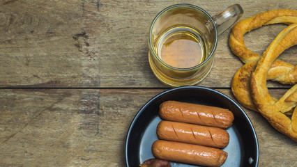 Beer mug, pretzels, and sausages .