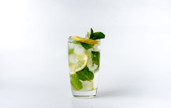 a glass with lemon and ice
