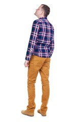 Back view of handsome man in checkered shirt  looking. Standing young guy in jeans. Rear view people collection.  backside view of person.  Isolated over white background.