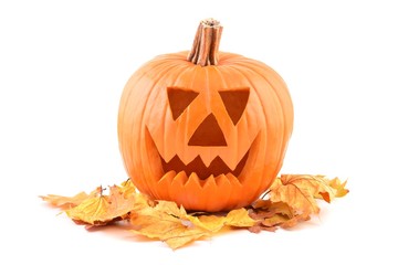 Halloween pumpkin. Halloween pumpkin and autumn leaves. Halloween pumpkin isolated on white.  