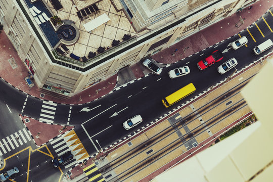 Colorful aerial view of a road intersection in Dubai Marina district with traffic and luxury hotels. Vintage effect.