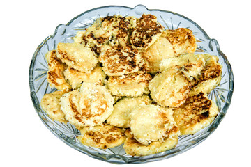 Fritters in glass plate on white background