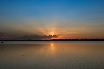 Fototapeta na wymiar Beautiful sunset over lake