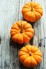 Autumn background with pumpkins with copy space, selective focus