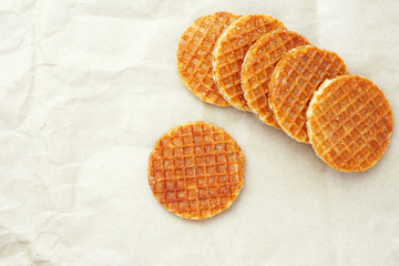 Top view of Dutch caramel waffles on a waxed paper.